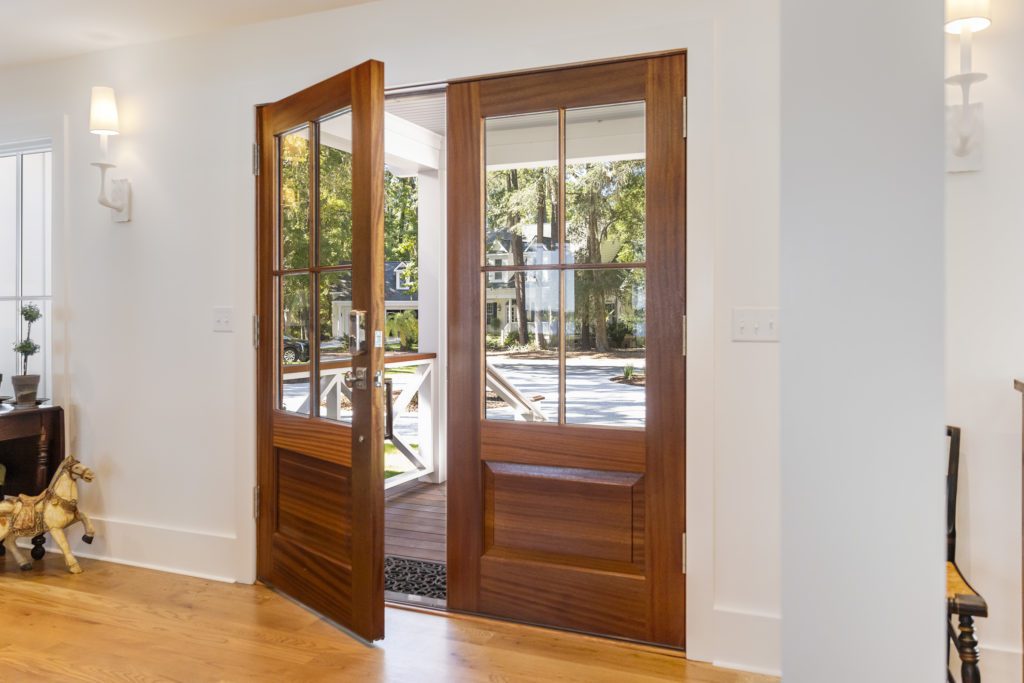 Lee-Bothell-7_06-1024x683 Custom Lowcountry Home Entrance with Wooden Doors and White Walls.