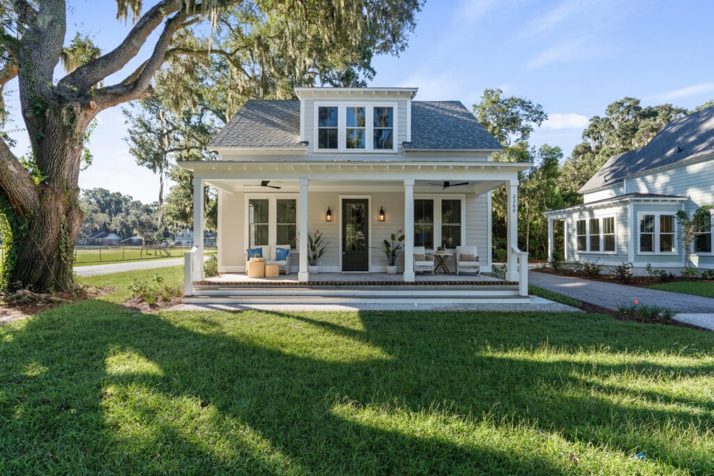 Custom coastal cottage at 2200 National Street in Beaufort, South Carolina, featuring Lowcountry architecture, a welcoming front porch, and luxury craftsmanship by Allen Patterson Builders.