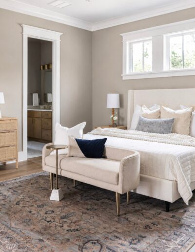 Primary bedroom suite at 4 Harborview Circle featuring hardwood floors, abundant natural light, and elegant Lowcountry design