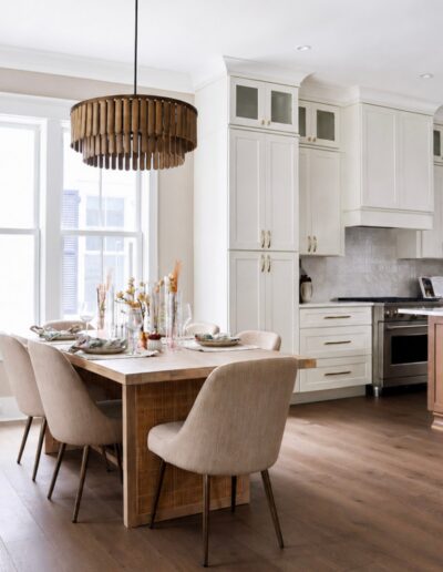 Designer kitchen and dining area at 4 Harborview Circle featuring custom cabinetry, a large island, and open-concept Lowcountry living