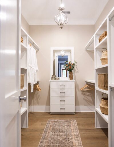 Walk-in closet at 4 Harborview Circle featuring custom built-in storage, shelving, and luxury organization solutions