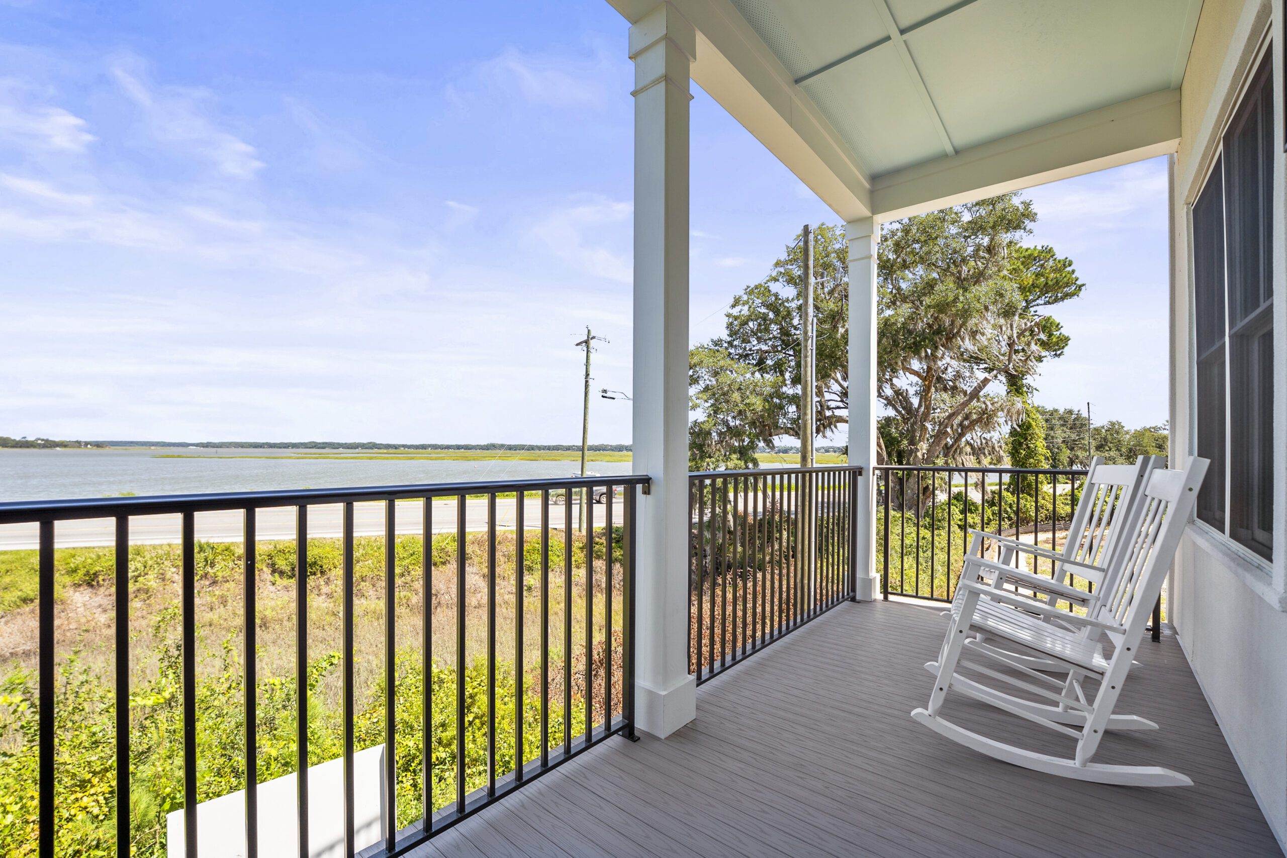 whitehall-point-townhome-interior-beaufort-sc Luxury townhome interior at Whitehall Point in Beaufort, South Carolina, featuring an open-concept living space, hardwood floors, natural light, and custom craftsmanship by Allen Patterson Builders.