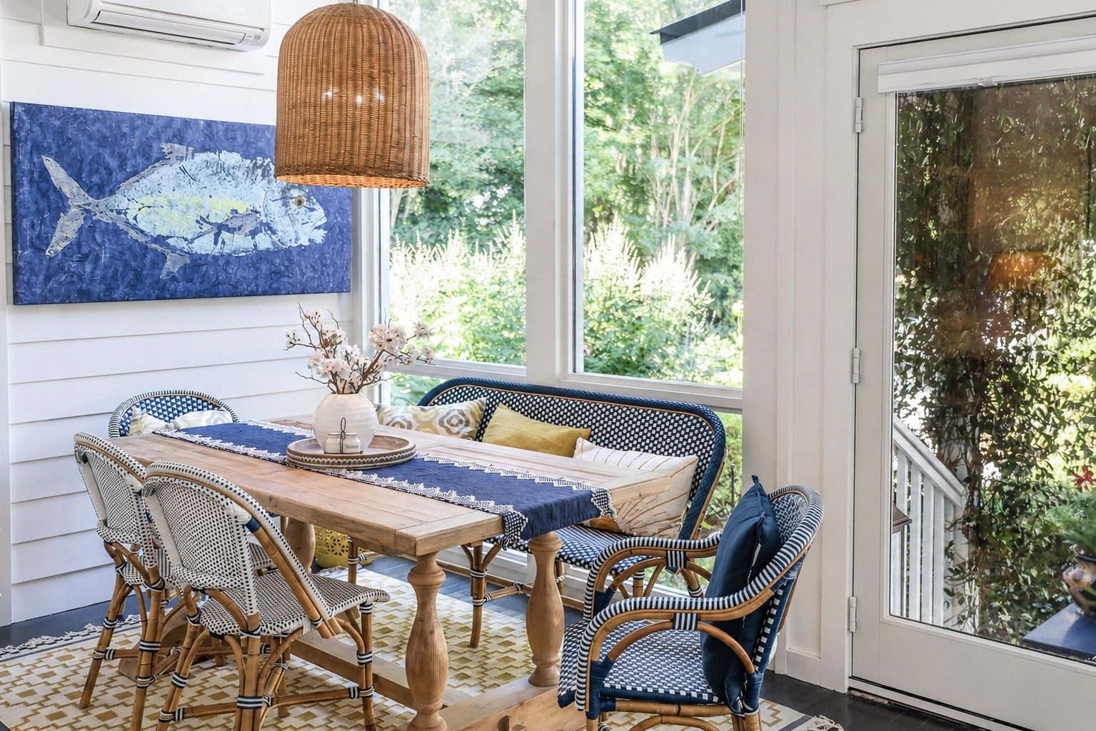 Luxury Lowcountry Home Poolside View with A Stone Patio and Serene Landscape.