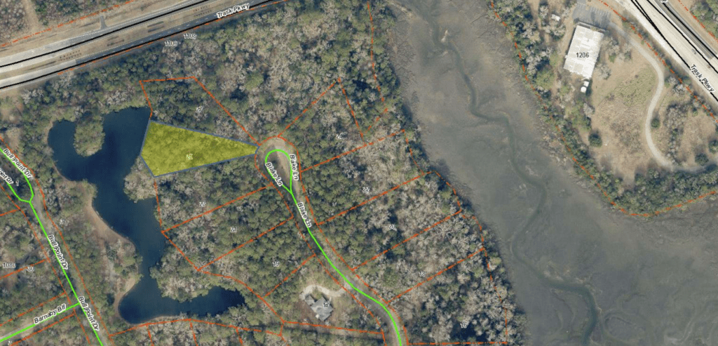 Aerial plat map of a wooded lagoon-front homesite for sale in Beaufort, South Carolina, near Bull Point Drive and Trask Parkway