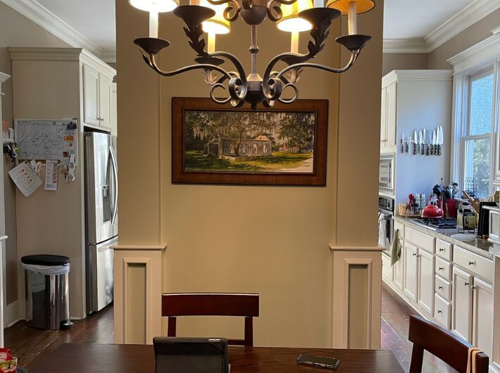 Original kitchen in Habersham, SC home prior to renovation by Allen Patterson Builders, showing dated cabinetry and layout later transformed with soapstone islands and custom millwork.